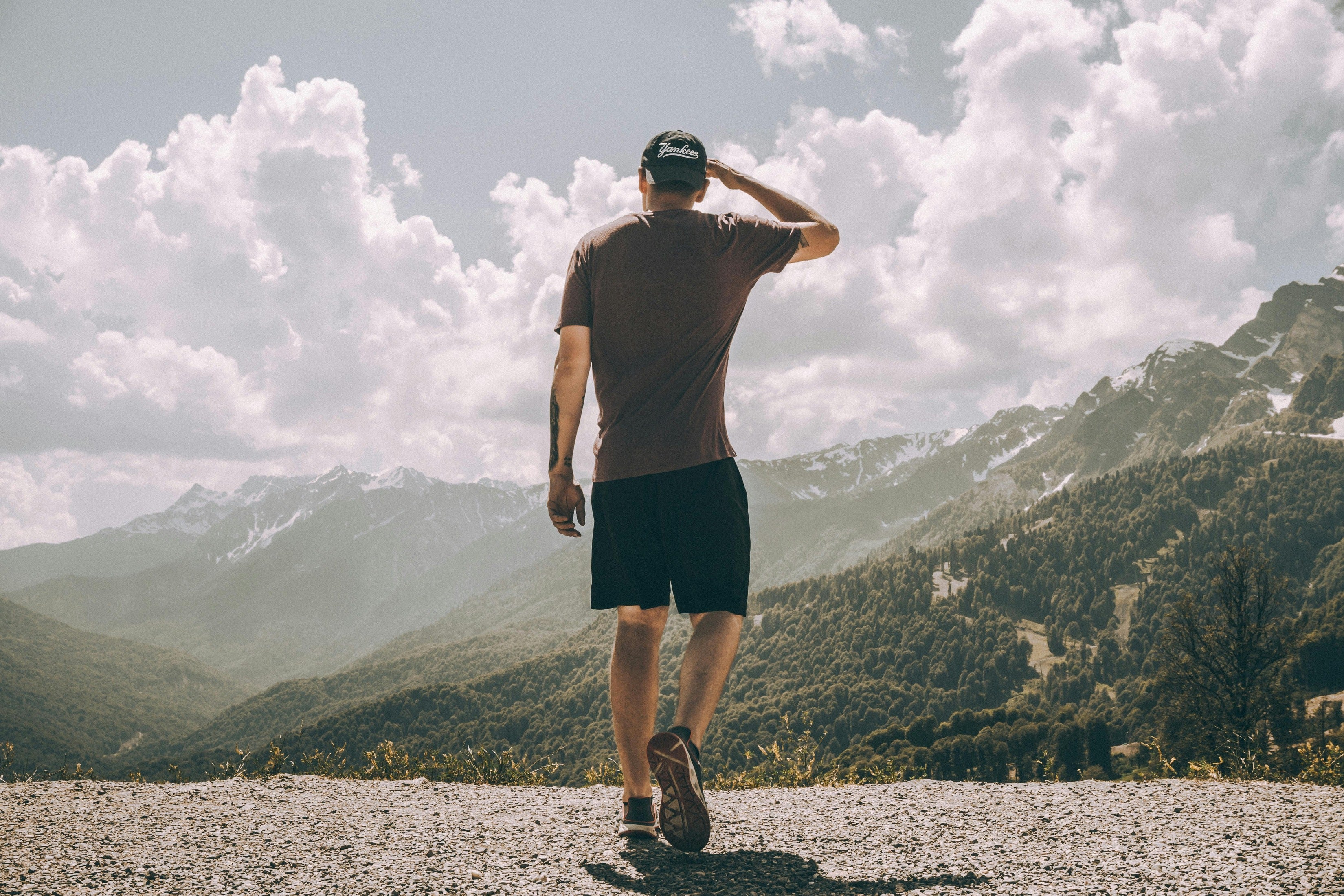 Man hiking and overlooking mountain before enjoying a nuwave protein shake 