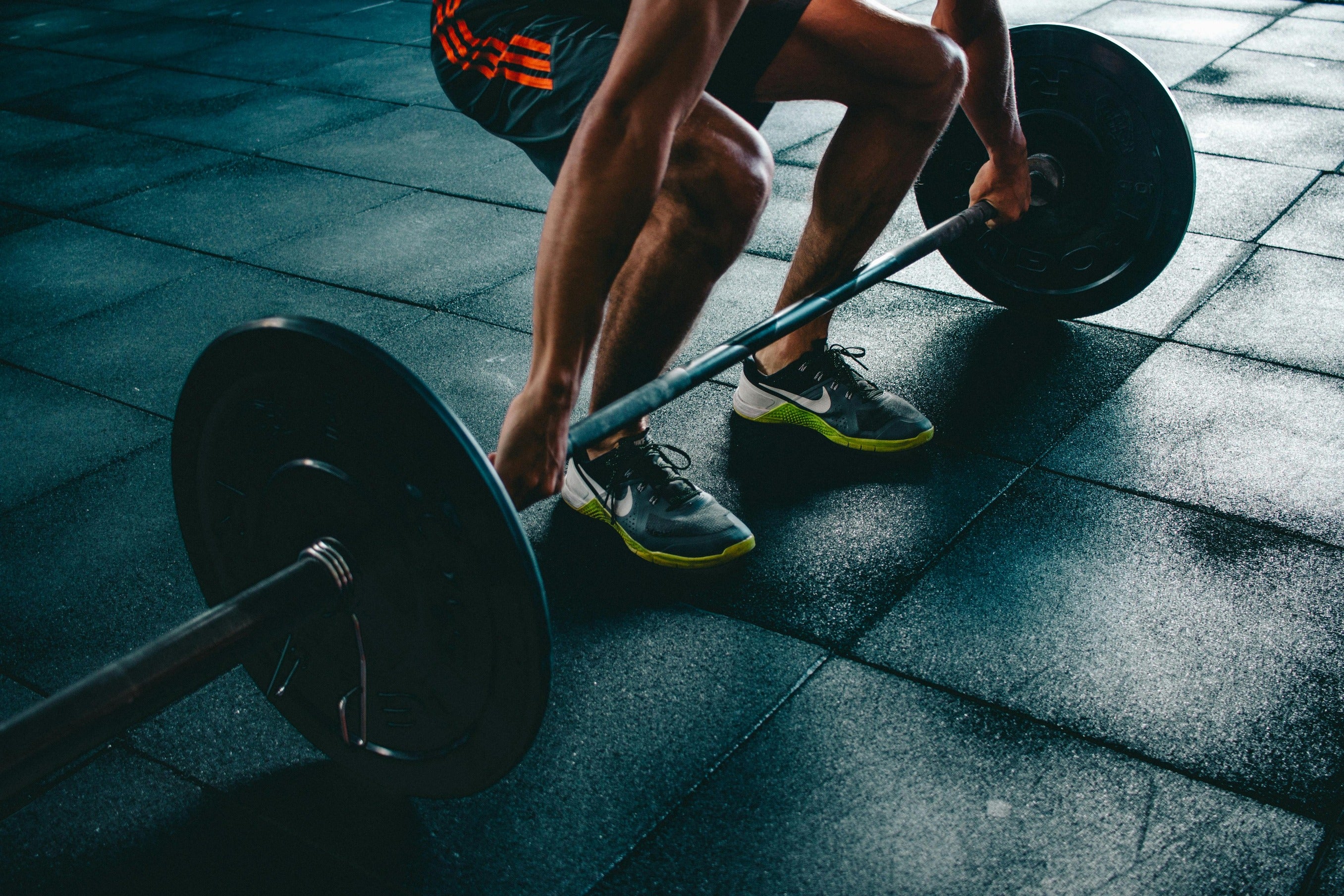 Man weight lifting showing the healthy active lifestyle that nuwave products support